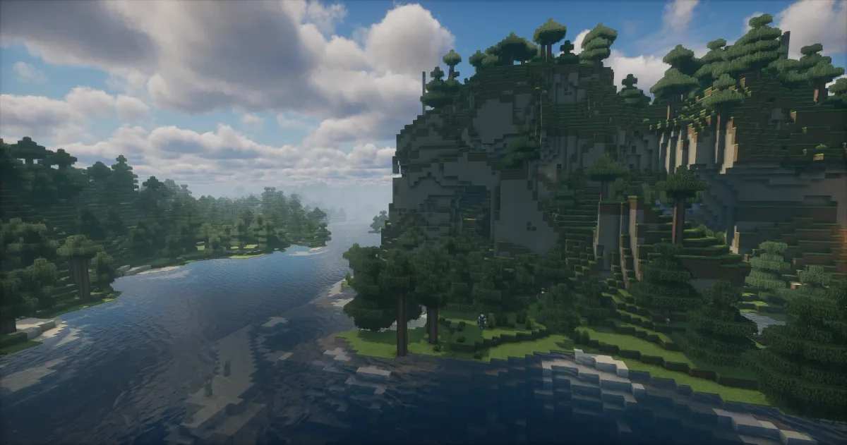 River under forested cliffs