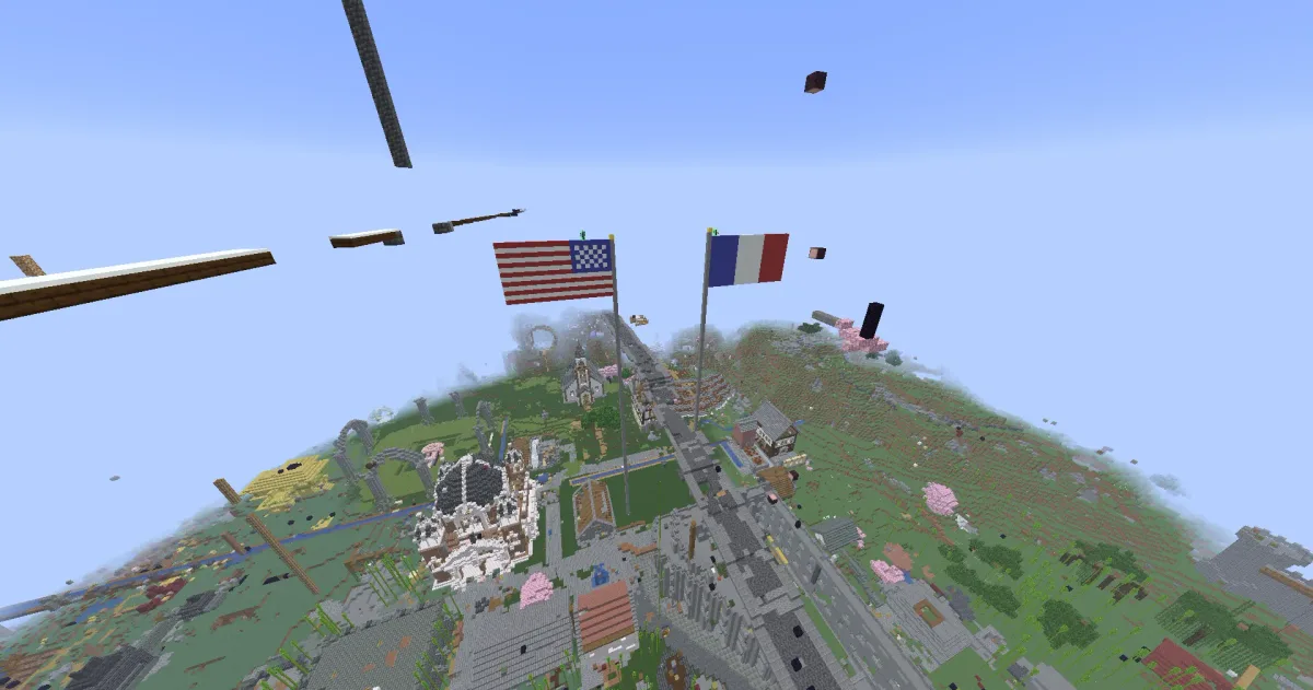 Aerial over spawn town with US and French flags, domed city hall